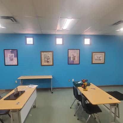 Commercial classroom furniture install with framed art